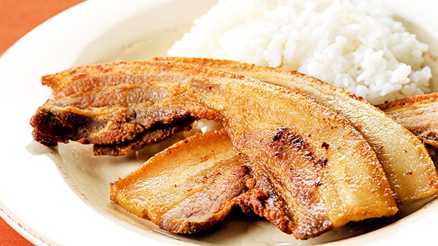 bacon liempo on a plate with rice