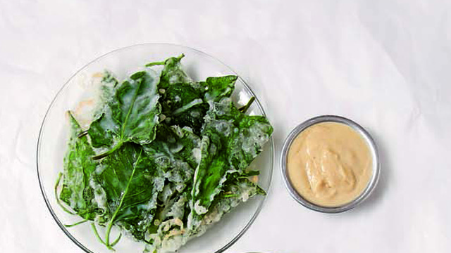 crispy kangkong on a clear plate