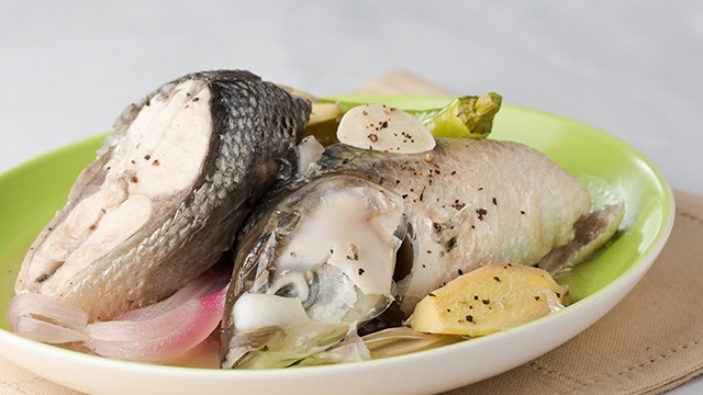 paksiw na isda with bangus or milkfish in a shallow bowl