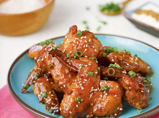 baked chicken wings on a blue plate