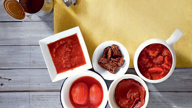 different kinds of tomatoes in different bowls