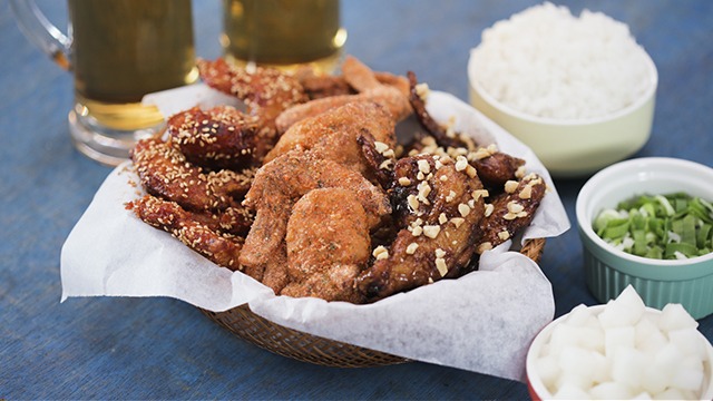 three kinds of korean fried chicken in a wicker serving bowl