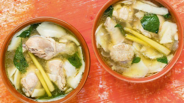 two bowls of chicken binakol in red bowls flatlay