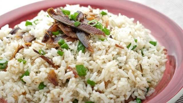 tuyo fried rice on a red plate