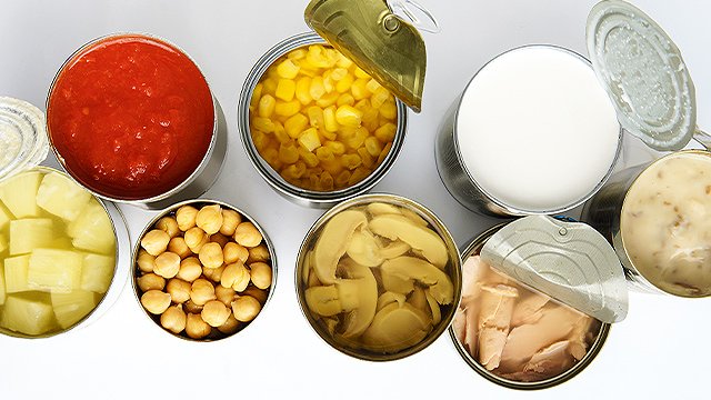different canned goods on a white background