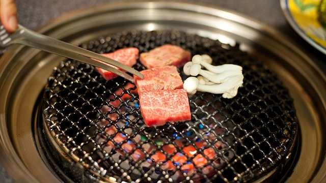 meat being seared over a korean grill