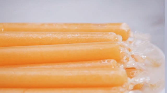 filled ice candy bags with melon juice ready to freeze 