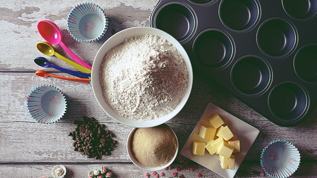 topshot of baking ingredients arranged on a wooden table