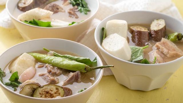 two bowls of sinigang na baboy or pork sinigang with okra, radish, and pork chunks
