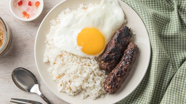 skinless beef longganisa on a plate with fried egg and rice