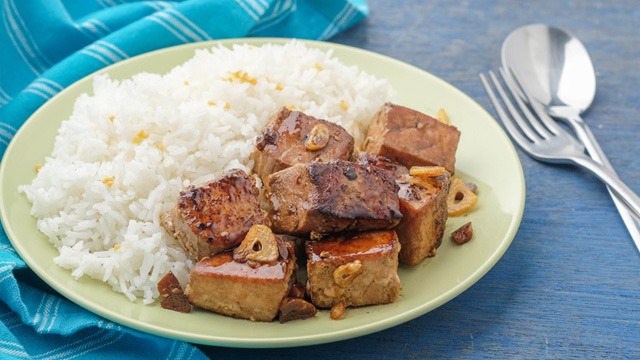 adobong tuna or tuna adobo on a plate with rice