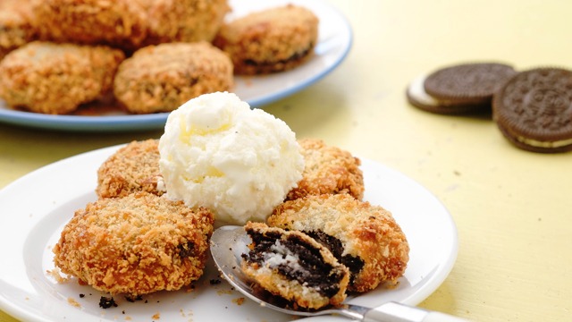 deep fried Oreos or wicked Oreos with a scoop of vanilla ice cream on a plate