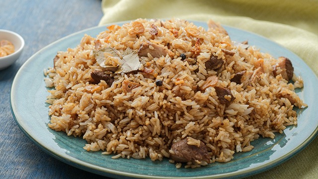 adobo fried rice on a blue plate