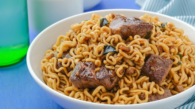 korean ram-don is made by combining seafood ramen and chapaghetti