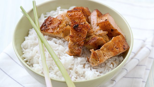 coconut liempo rice topped with liempo and lemongrass