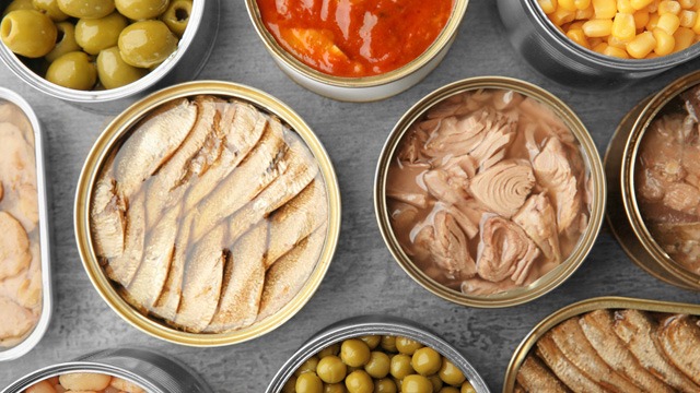 canned food, sardines, tuna in supermarket shelves