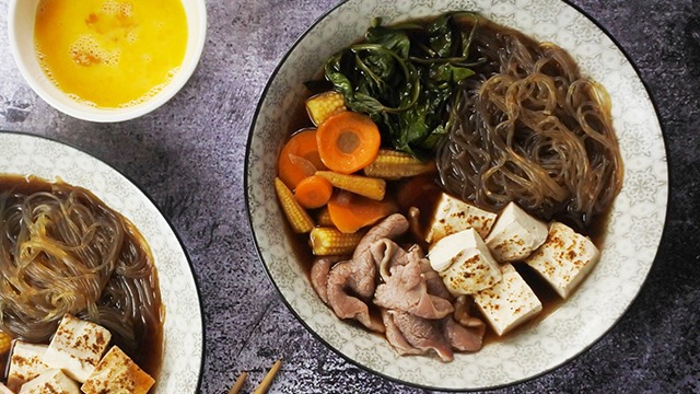 Sukiyaki: Japanese hot pot with beef, tofu, rice noodles and vegetables