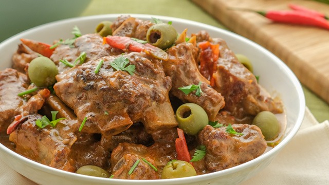 beef caldereta topped with olives