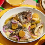 Paksiw na tilapia in a white plate