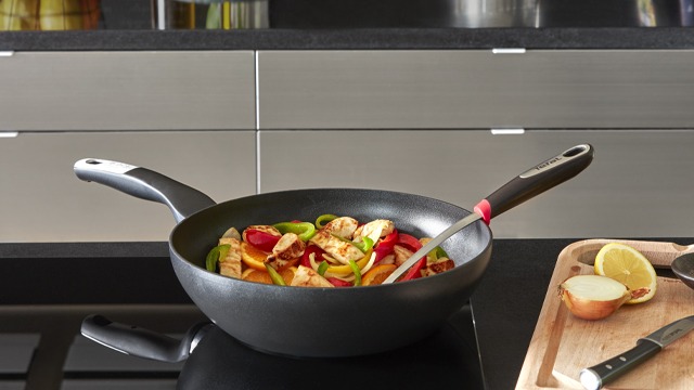 Tefal nonstick wok with vegetables in kitchen