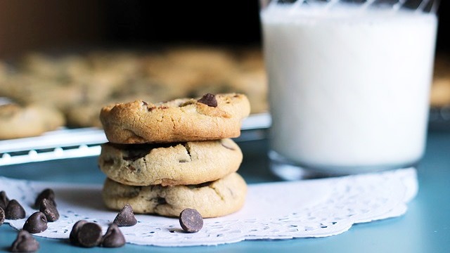 chocolate chip cookies on a wooden bowl