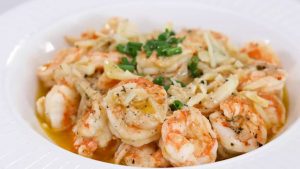cooked garlic butter shrimp in a bowl with parsley
