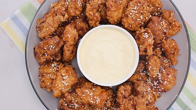 boneless fried chicken pieces and gooey cheese dip