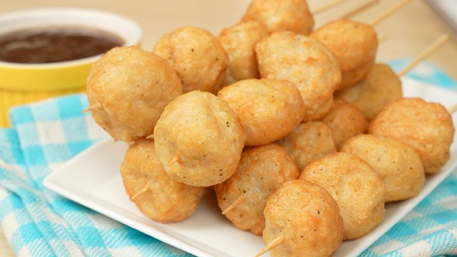 street food chicken balls recipe on bamboo sticks with fish ball sauce