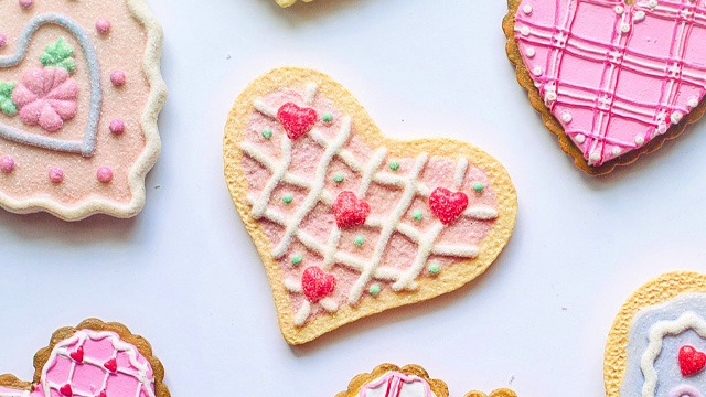 heart shaped cookies with valentine's day icing decorations