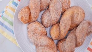 bicho bicho doughnuts or filipino style twisted doughnuts in cinnamon sugar