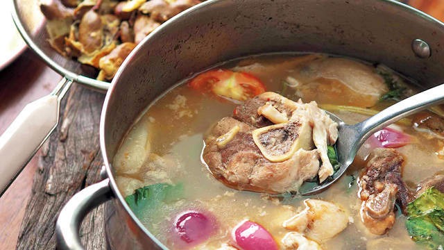 filipino food sinigang na baboy sa sampaloc or sour tamarind pork soup