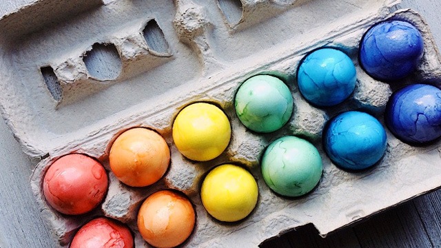 dyed easter eggs in a tray ready for hiding