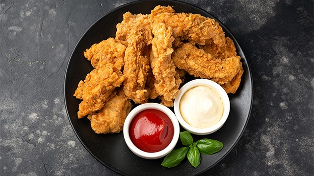 chicken fingers with ketchup and mayonnaise