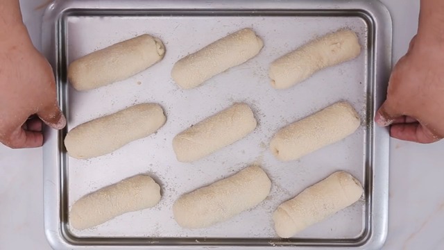 dough rolls on baking sheet