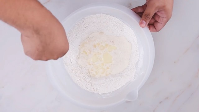 the dough ingredients in mixing bowl with spatula