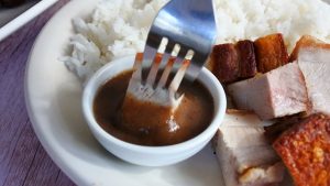 dip the chunks of pork belly or lechon kawali in lechon sauce