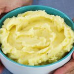 mashed potatoes in a bowl with hands