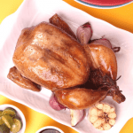 turbe broiler chicken on a rectangular plate and a yellow background