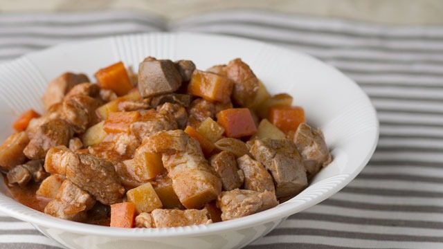 pork menudo in a white bowl